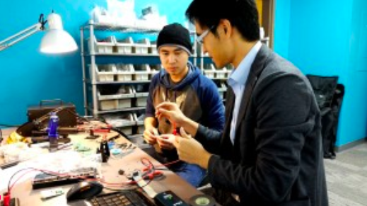 Robotics engineers working on circuitry