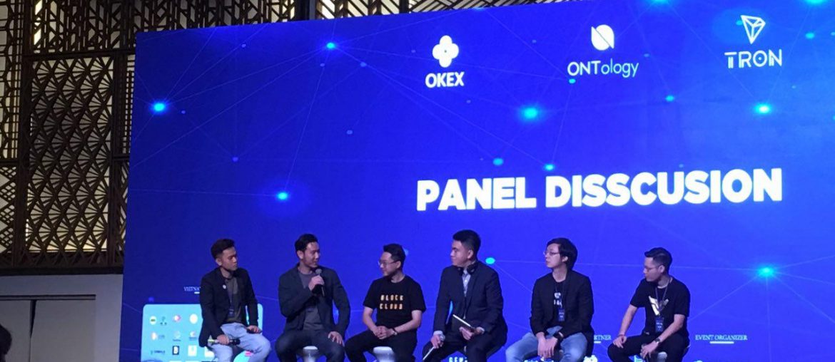 Photo of Thuc Vu on stage at OKEX event.