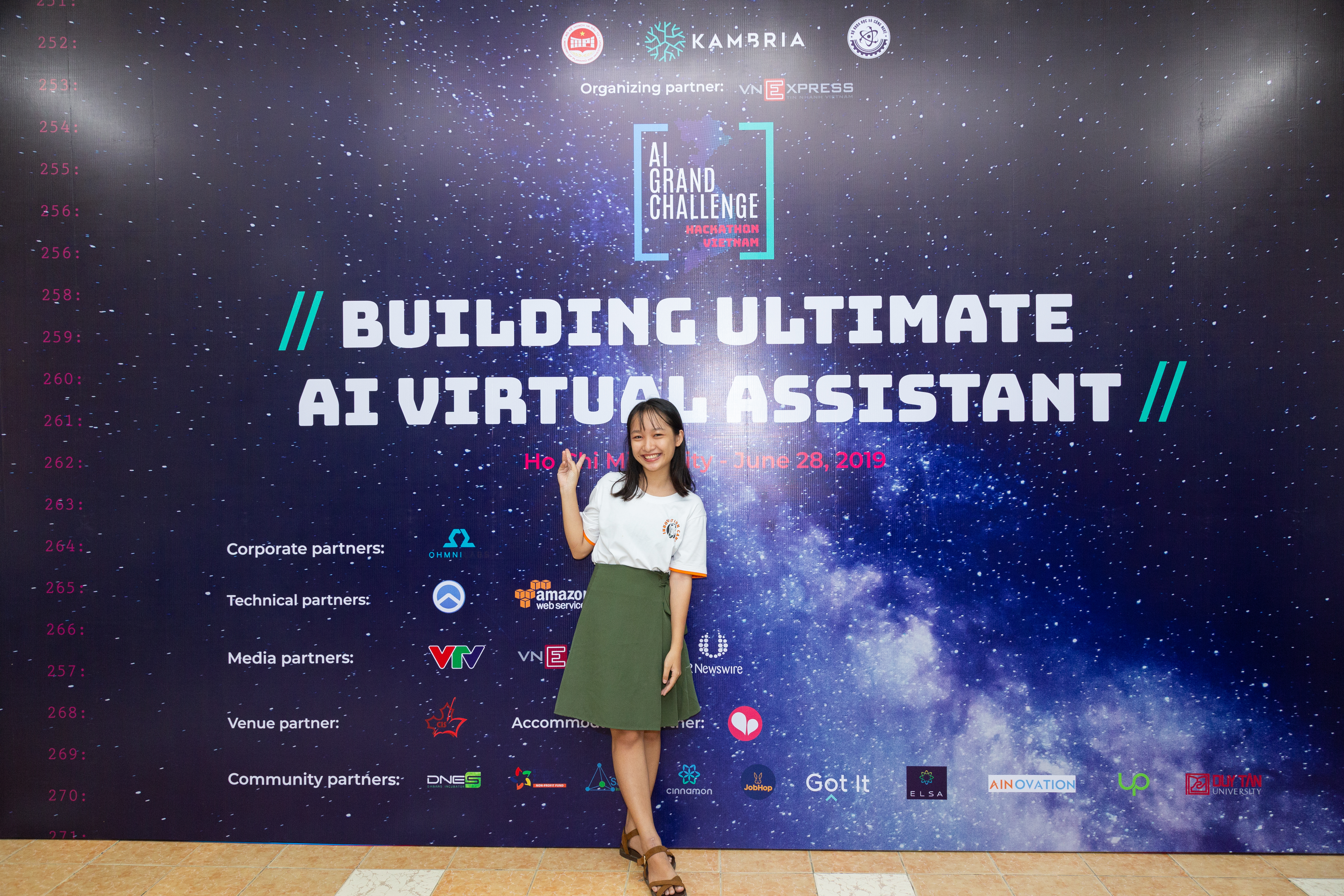 Vietnam AI Grand Challenge Hackthon poster with a girl standing in front of it