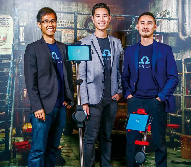 OhmniLabs Founders standing in front of an Ohmni first generation Robot. Pictured is Dr. Thuc Vu, Jared Go, and Tingxi Tan