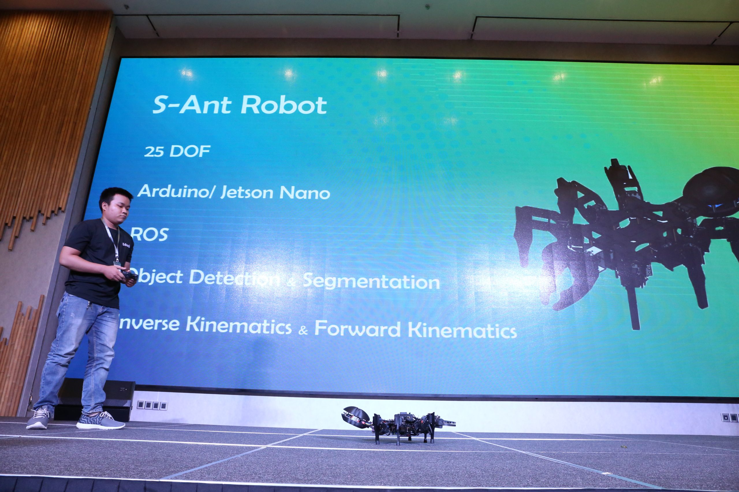 Phuong Hoang on stage with their S Ant 2 robot